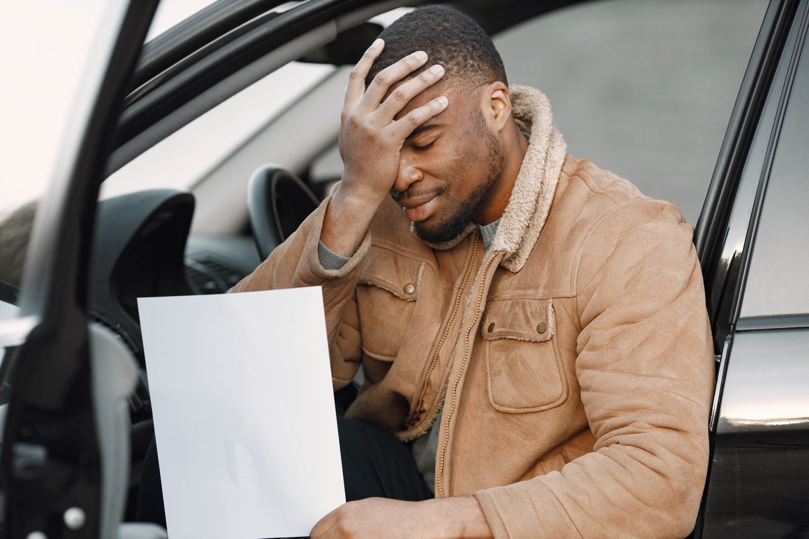 Injured driver reviewing medical records and wage statements with a personal injury lawyer