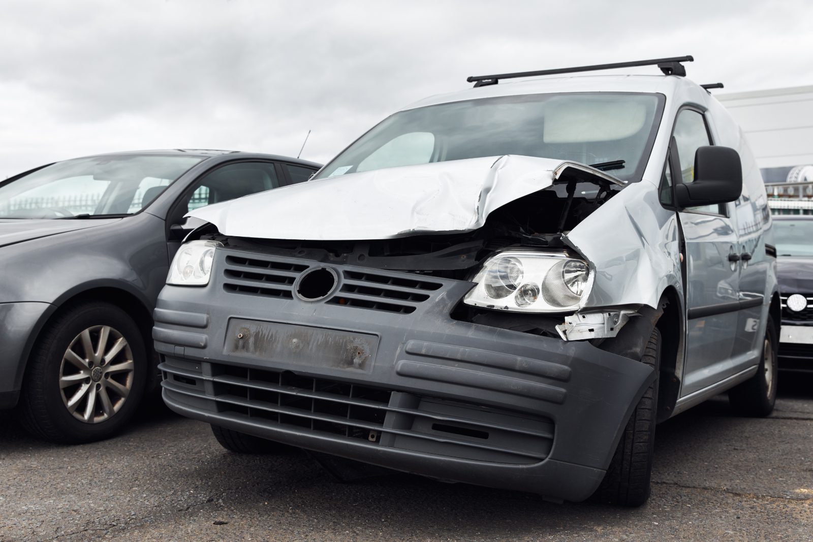 Delivery van with front-end damage after a collision